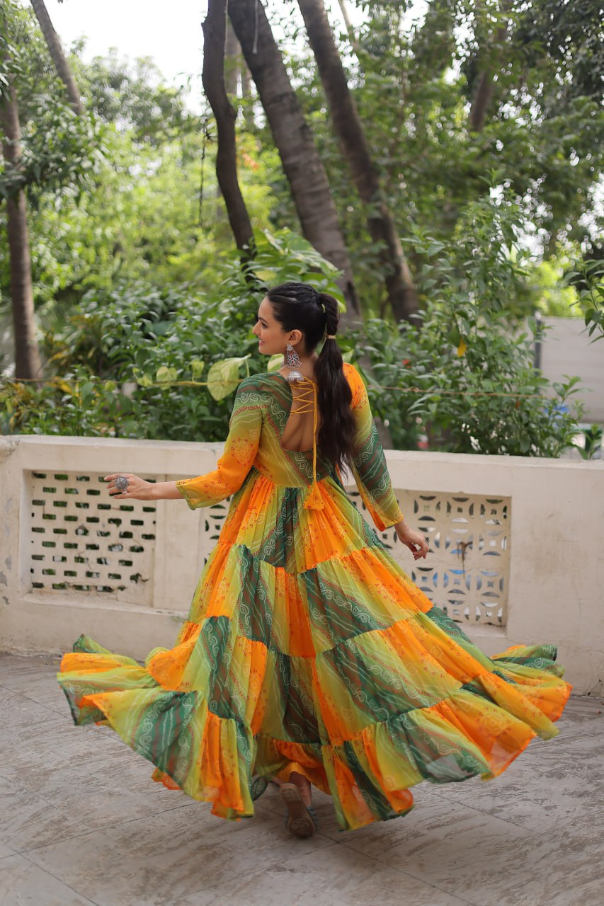 Yellow and green faux georgette Laheriya and bandhej print with katchi patch work gown