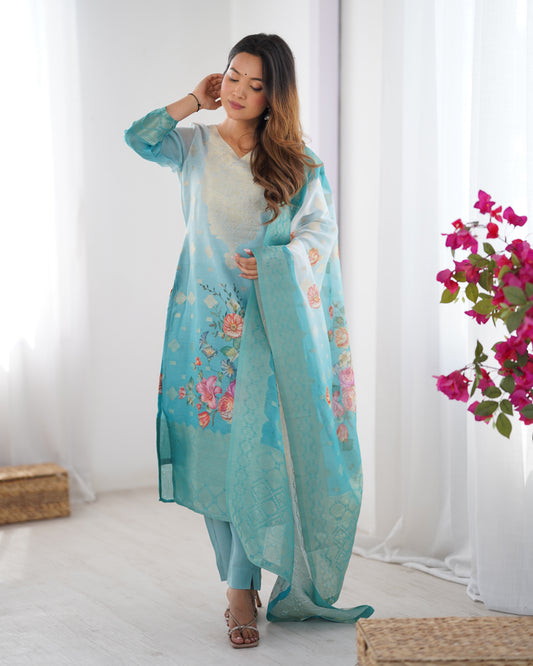 Woman wearing a light blue floral outfit with a white background and pink flowers.